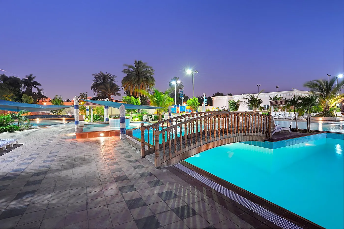 Bridge over the lagoon pool at dusk