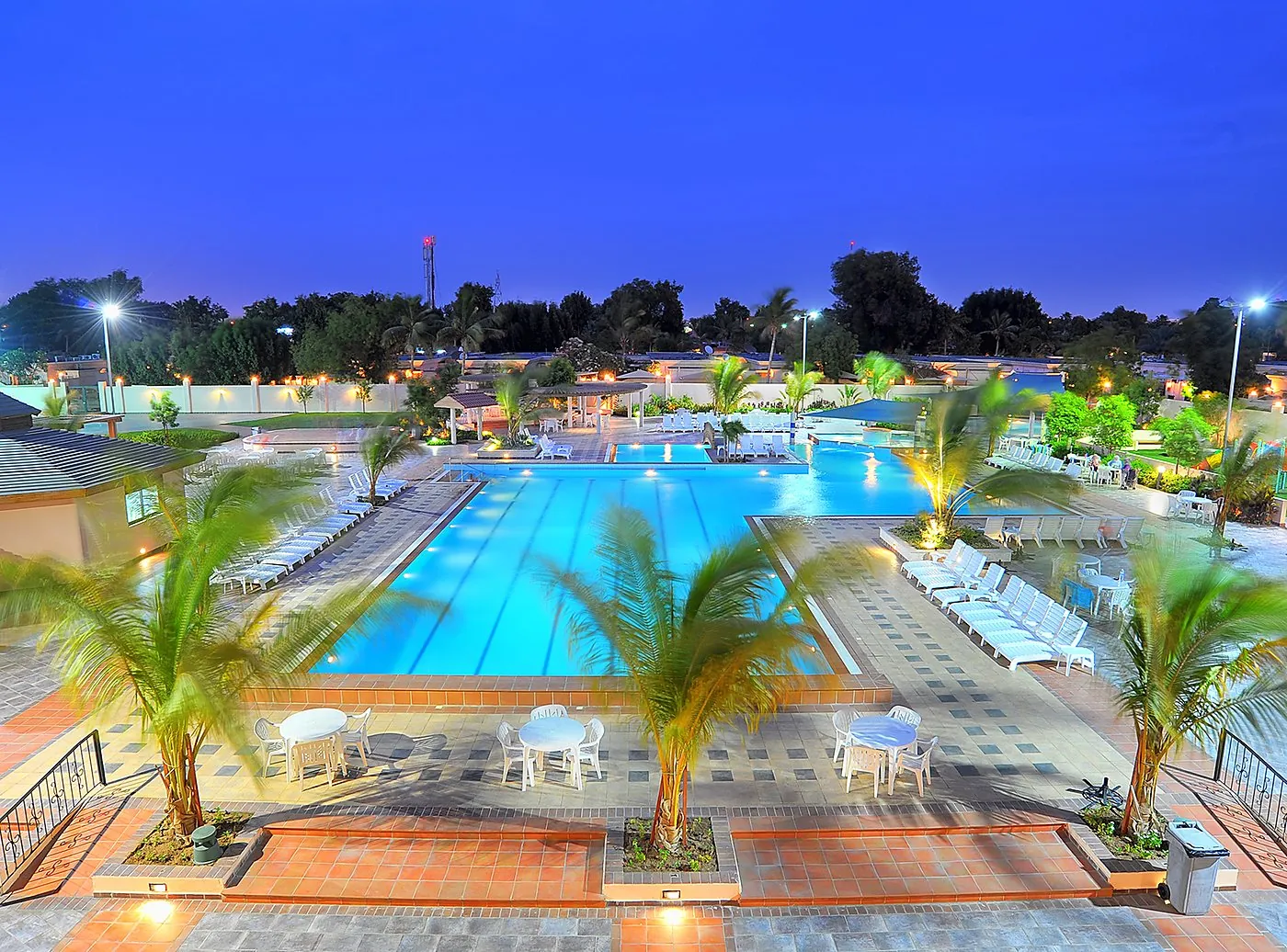 Blue-hour view of the pool
