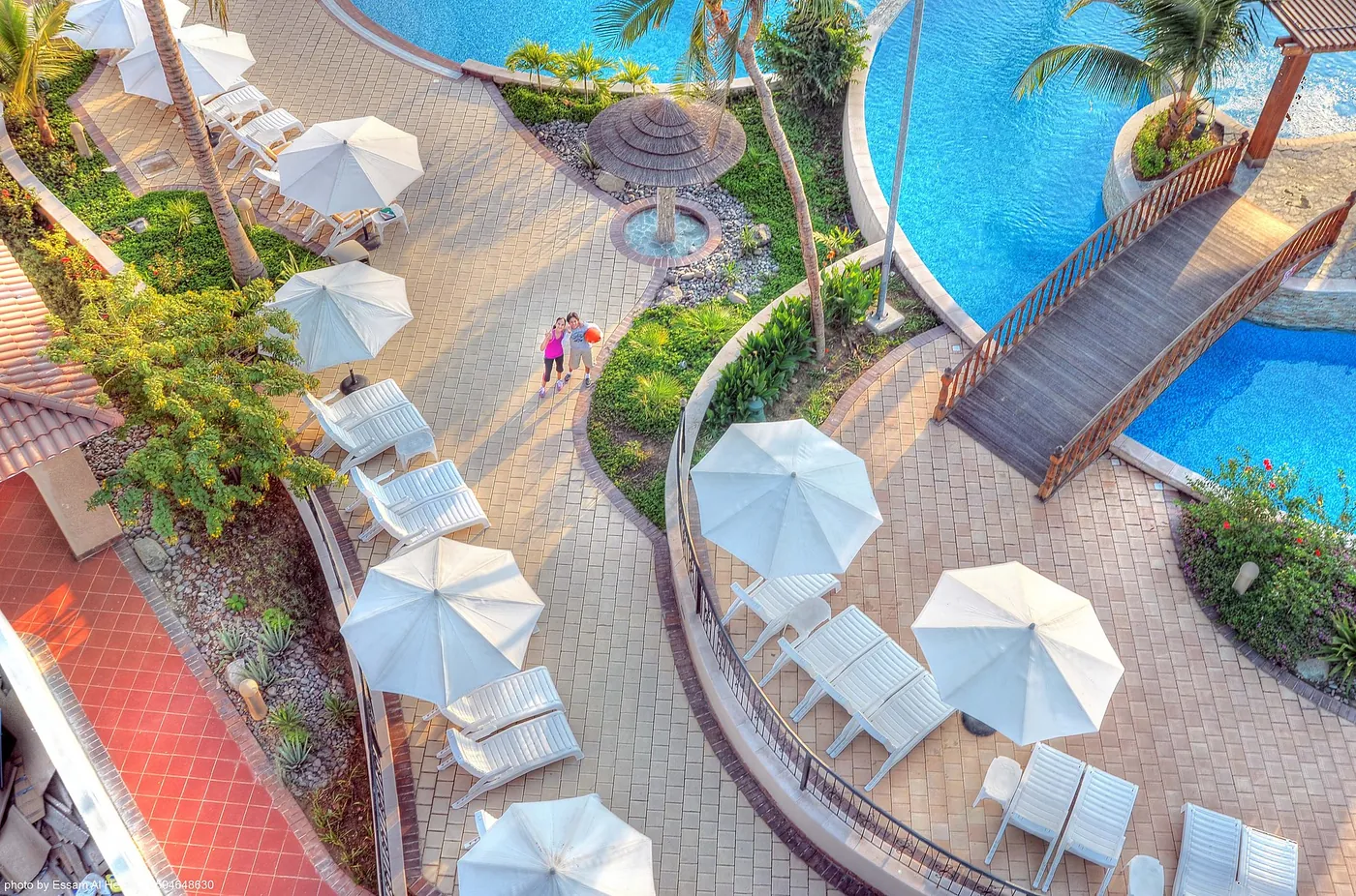 Resort pool with sun loungers