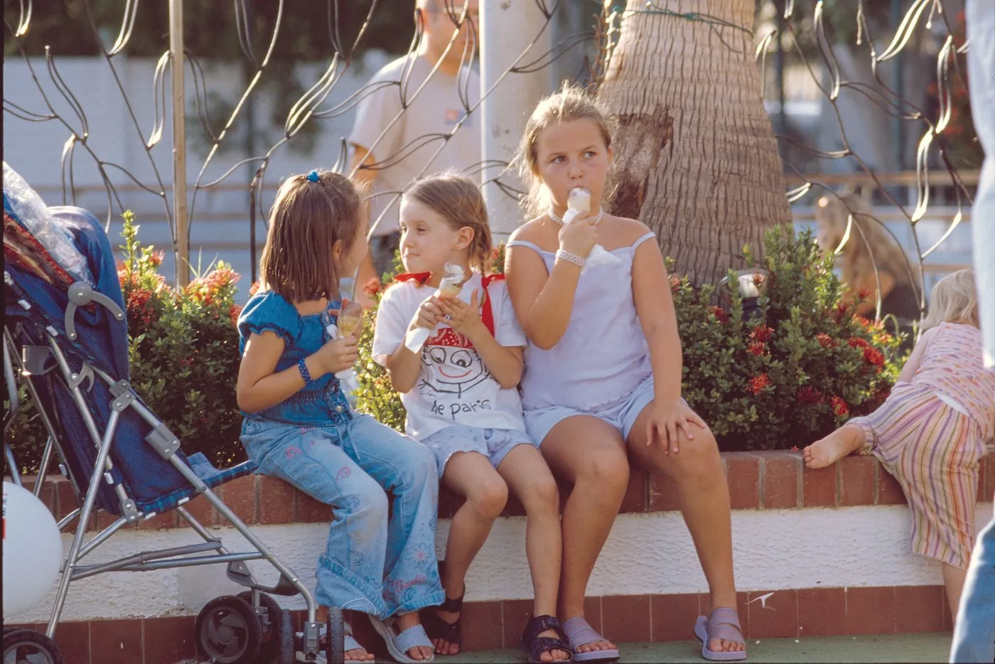 Children enjoying a summer afternoon by the pool