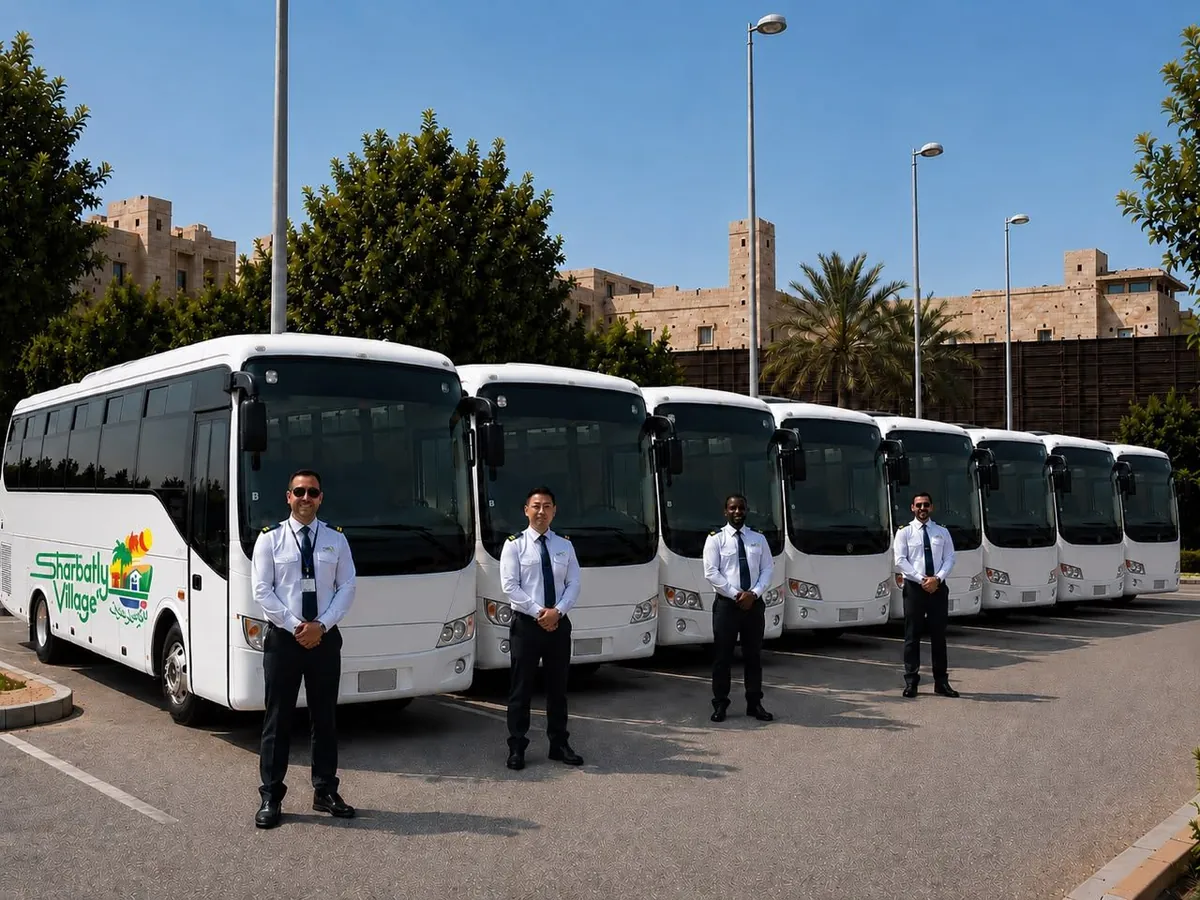 Sharbatly Village school bus fleet with uniformed drivers